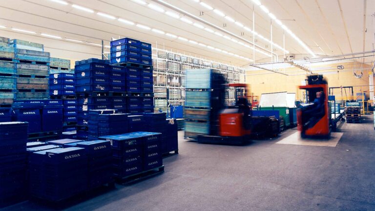 Manufacturing hall with driving forklift